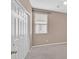 Spacious room with a closet, window with blinds, and carpeted floors at 8220 Redbud Vine St, North Las Vegas, NV 89085