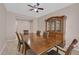 Dining room features a wooden table, chairs, and china cabinet, perfect for gatherings at 8220 Redbud Vine St, North Las Vegas, NV 89085