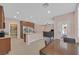 An open kitchen with stainless steel appliances, granite countertops, a pantry, and a center island, great for cooking at 8220 Redbud Vine St, North Las Vegas, NV 89085