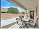 Outdoor patio area includes a patio table and four chairs at 8220 Redbud Vine St, North Las Vegas, NV 89085