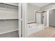 Well-lit bathroom with a separate bathtub, shower, and a glimpse of a walk-in closet providing a spa-like experience at 840 Picotte St # 101, Las Vegas, NV 89144