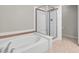 Bright bathroom featuring a separate shower and soaking tub with tile surround at 840 Picotte St # 101, Las Vegas, NV 89144