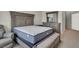 Bedroom featuring a bed with upholstered headboard, dresser, and arm chair at 840 Picotte St # 101, Las Vegas, NV 89144