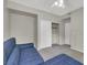 Bedroom with a blue sofa bed and a double door closet at 840 Picotte St # 101, Las Vegas, NV 89144
