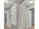 Neutral hallway with white doors leading to various rooms at 840 Picotte St # 101, Las Vegas, NV 89144