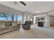 Bright living room with large windows, comfortable seating, open layout flowing into the kitchen area at 840 Picotte St # 101, Las Vegas, NV 89144
