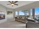 Comfortable living room with a fireplace, large windows offering natural light and a neutral color palette at 840 Picotte St # 101, Las Vegas, NV 89144