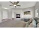 Inviting living room featuring a cozy fireplace, neutral walls, and modern ceiling fan for comfort at 840 Picotte St # 101, Las Vegas, NV 89144