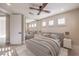 Serene bedroom featuring a comfortable bed, mirrored closet doors, and well-lit windows for a relaxing retreat at 8808 Rozetta Ct, Las Vegas, NV 89134