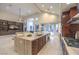 Open-concept kitchen with a large central island, stainless steel appliances, and seamless access to the living area at 8808 Rozetta Ct, Las Vegas, NV 89134
