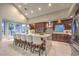 Gourmet kitchen featuring stainless appliances, custom cabinetry, and a large center island with seating at 8808 Rozetta Ct, Las Vegas, NV 89134