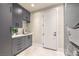 The laundry room features gray cabinets, a sink, and modern washer/dryer at 8808 Rozetta Ct, Las Vegas, NV 89134