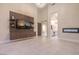 An open-concept living area boasts a fireplace, and modern media center at 8808 Rozetta Ct, Las Vegas, NV 89134