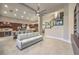 Bright and airy living space with a kitchen, staircase, and an adjacent seating area at 8808 Rozetta Ct, Las Vegas, NV 89134