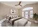 Vaulted main bedroom has door to the outside, stylish furniture, and ample light at 8808 Rozetta Ct, Las Vegas, NV 89134