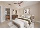 Inviting main bedroom boasts stylish furniture, art and an ensuite bathroom at 8808 Rozetta Ct, Las Vegas, NV 89134