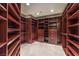Spacious walk-in closet with custom wood shelving and drawers offering ample storage space at 8808 Rozetta Ct, Las Vegas, NV 89134