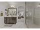 Stylish bathroom connecting to bedroom; featuring modern fixtures and walk-in shower at 8992 Sparkling River Ct, Las Vegas, NV 89178