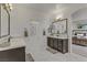 Bright bathroom with double sinks, modern fixtures, and ensuite access to the main bedroom at 8992 Sparkling River Ct, Las Vegas, NV 89178