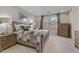 Serene bedroom with natural light, rustic furniture, and comfortable bedding at 8992 Sparkling River Ct, Las Vegas, NV 89178