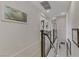Open hallway featuring modern railing, artwork, and access to multiple rooms at 8992 Sparkling River Ct, Las Vegas, NV 89178