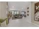 Open floorplan living room featuring tile floors, neutral decor and recessed lighting at 8992 Sparkling River Ct, Las Vegas, NV 89178