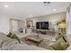 Inviting living room with cozy seating, accent pillows, and decorative elements at 8992 Sparkling River Ct, Las Vegas, NV 89178