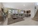 Open floorplan living room with tile floors and view of the kitchen at 8992 Sparkling River Ct, Las Vegas, NV 89178
