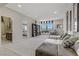 Spacious living area with a large sectional sofa, built-in shelving, and plenty of natural light at 8992 Sparkling River Ct, Las Vegas, NV 89178