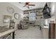 Home office featuring built-in shelving, ceiling fan and comfortable chair at 8992 Sparkling River Ct, Las Vegas, NV 89178