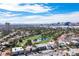 Beautiful aerial view showcases the community, golf course, and the Las Vegas skyline in the background at 915 Vegas Valley Dr # 4, Las Vegas, NV 89109