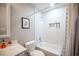 Bathroom features a white-tiled shower and tub combo, complemented by sleek fixtures at 915 Vegas Valley Dr # 4, Las Vegas, NV 89109