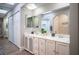 Bright bathroom featuring double sinks, marble countertops, shower and ample storage at 915 Vegas Valley Dr # 4, Las Vegas, NV 89109