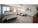 Spacious bedroom with two beds, a bench, and soft carpeting for a cozy atmosphere at 915 Vegas Valley Dr # 4, Las Vegas, NV 89109
