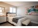 Inviting bedroom with a comfortable bed, bench, and contemporary artwork at 915 Vegas Valley Dr # 4, Las Vegas, NV 89109