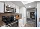 Well-lit kitchen featuring modern stainless steel appliances and sleek countertops at 915 Vegas Valley Dr # 4, Las Vegas, NV 89109