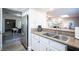 Kitchen featuring white cabinets, stainless steel appliances, and granite countertops at 915 Vegas Valley Dr # 4, Las Vegas, NV 89109