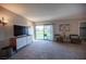 Bright living room with sliding doors and a balcony overlooking green space at 915 Vegas Valley Dr # 4, Las Vegas, NV 89109