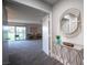 Open living room with a mirror, glass table, and balcony, creating a bright and airy space at 915 Vegas Valley Dr # 4, Las Vegas, NV 89109