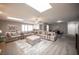 Expansive living space with a huge sectional sofa, skylights, and an open layout connecting to the dining area at 915 Vegas Valley Dr # 4, Las Vegas, NV 89109