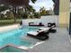 Inviting backyard pool area with comfortable lounge chairs, patio seating, and scenic golf course views at 916 Vegas Valley Dr, Las Vegas, NV 89109