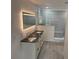 Modern bathroom featuring dual sinks with black granite countertops and a glass-enclosed shower at 916 Vegas Valley Dr, Las Vegas, NV 89109