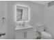 Bright bathroom featuring a vanity with modern fixtures and a well-lit mirror at 916 Vegas Valley Dr, Las Vegas, NV 89109