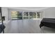 Spacious bedroom featuring a wall of windows and access to an outdoor balcony at 916 Vegas Valley Dr, Las Vegas, NV 89109