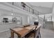 Open-concept dining area featuring modern finishes, wood table, stairs to loft, and seamless flow into the kitchen at 916 Vegas Valley Dr, Las Vegas, NV 89109
