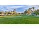 Scenic golf course featuring lush green fairways, mature trees, and a distant cityscape at 916 Vegas Valley Dr, Las Vegas, NV 89109