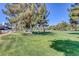 Expansive green golf course with mature trees and distant views of the Stratosphere and surrounding buildings at 916 Vegas Valley Dr, Las Vegas, NV 89109