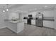 Modern kitchen featuring stainless steel appliances, granite countertops, and white cabinets, offering a sleek design at 916 Vegas Valley Dr, Las Vegas, NV 89109