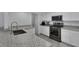 Bright kitchen with stainless steel appliances, granite countertops, and modern fixtures at 916 Vegas Valley Dr, Las Vegas, NV 89109