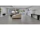 Spacious living room with light hardwood floors, modern furniture, a fireplace, and natural light from large windows at 916 Vegas Valley Dr, Las Vegas, NV 89109